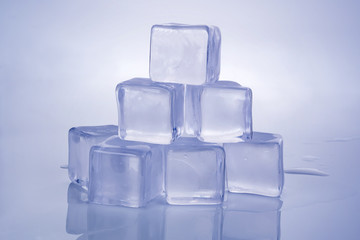 Pile of ice cubes on white background.