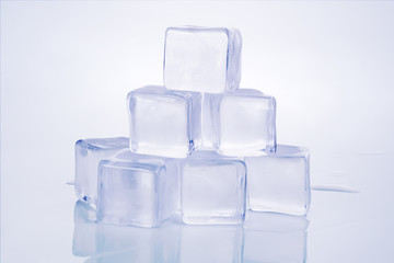 Pile of ice cubes on white background.