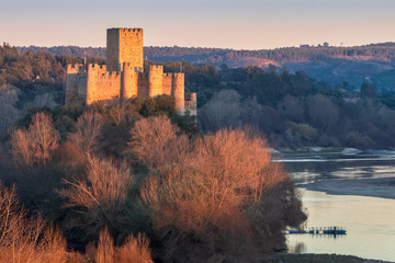 Almourol, Portugal - January 12, 2019: 12th century Almourol castle and Tagus river at sunset on a...