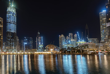 Fototapeta na wymiar Buildings of Dubai across the water at night