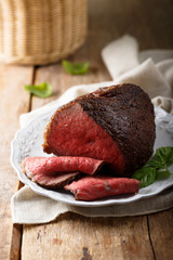 Homemade roast beef served on a white plate