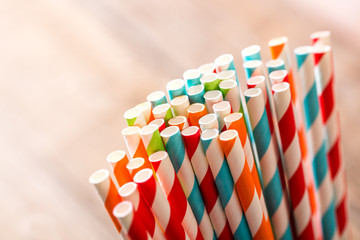 Eco friendly stripped paper straws in a glass, closeup