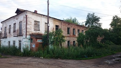 Abandoned brick and wooden houses in pishchita, located in Ostashkov, Tver region, Russia.