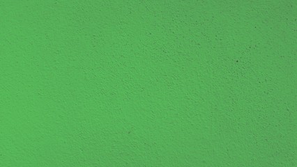 Abstract background of green rough cement.