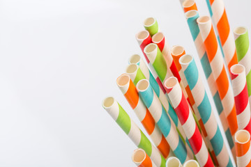 Vivid eco striped paper straws in a glass