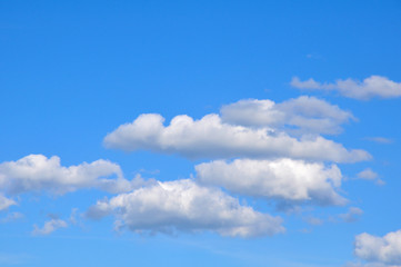 Fototapeta na wymiar White clouds against the blue sky