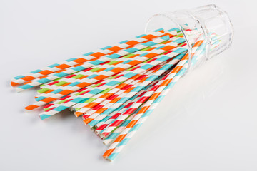 Vivid eco striped paper straws in a glass