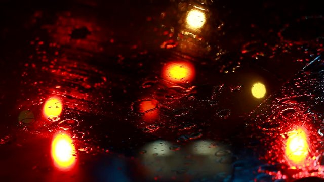 driving car during traffic jam and raining on road