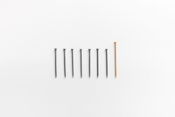 Row of matches with one big in lead on white