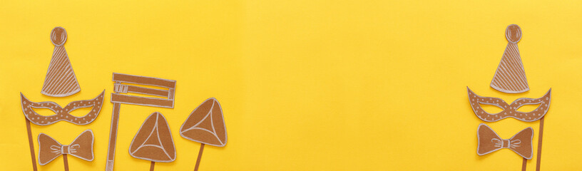 Purim celebration concept (jewish carnival holiday). Traditional symbols shapes cutted from paper