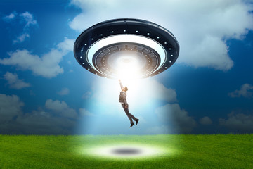 Flying saucer abducting young businessman 