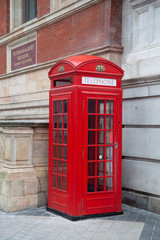 Fototapeta na wymiar Red Telephone box outside London Museum