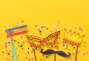 Purim celebration concept (jewish carnival holiday). Traditional symbols shapes cutted from paper