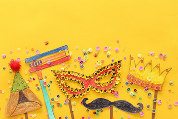 Purim celebration concept (jewish carnival holiday). Traditional symbols shapes cutted from paper