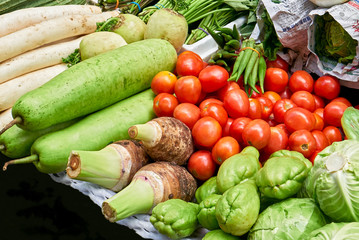 Close-up of various kind of green and red colored vegetables displayed for sale by vendors at a street in Chinatown, Manila, Philippines