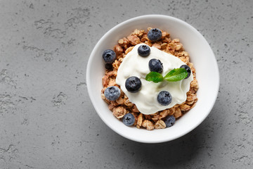 Bowl with granola and yogurt, top view