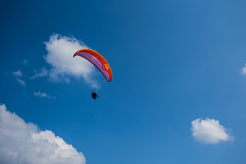 closeup paraglider fly in a blue sky