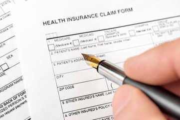 Filing health insurance claim form. Top view.