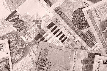Different countries money background close up. Brown color toned