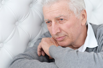 Close up portrait of thoughtful senior man posing