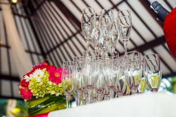 Champagne glasses arranged for wedding reception