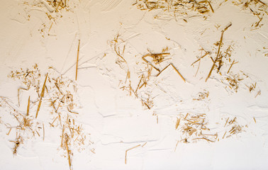New white plaster with straws on wall