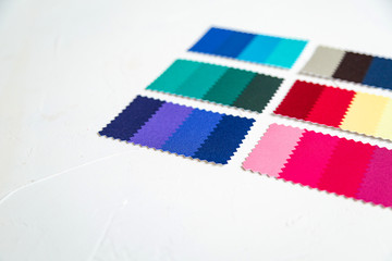Top view of colorful  felt  swatches on white background. Instrument for color type determination&