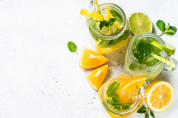 Lemonade, mojito and orange lemonade on white.