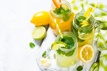 Lemonade, mojito and orange lemonade on white.