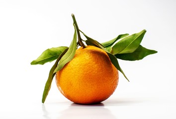 Mandarin with green leaves isolated on white background.