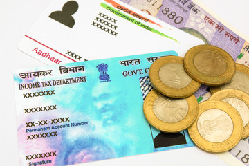 Aadhar card and pan card which are issued by Government of India as an identity card with Indian currency