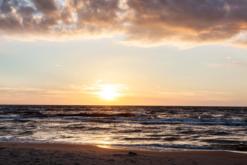 Naklejka na ściany i meble Sunset on the beach, polish sea baltic