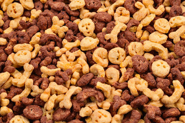  Chocolate flakes in the form of skulls and bones background. Top view.