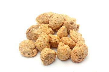 Soy meat in chunks on white background. Raw soybeans chunks