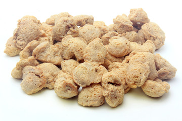 Soy meat in chunks on white background. Raw soybeans chunks