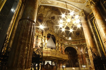 Fototapeta na wymiar Lights of faith in Consolata Church in Turin, Piemonte, Italia