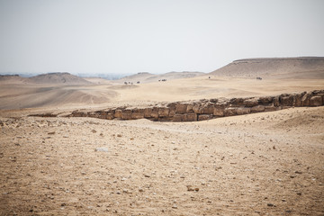 Desert landscape in Giza Egypt with Cairo on background