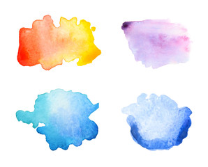 Set with abstract brushstrokes of watercolor paints on white background, top view