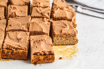 Vegan square cake with cocoa cream.