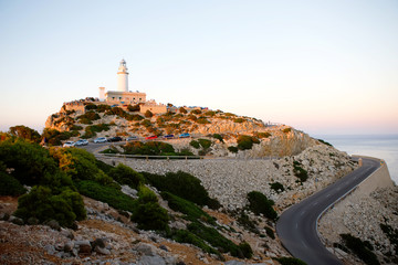 Fototapeta na wymiar Beautiful white Lighthouse at Cape Formentor in the Coast of North Mallorca, Spain. Balearic Islands . Artistic sunrise and dusk landascape.