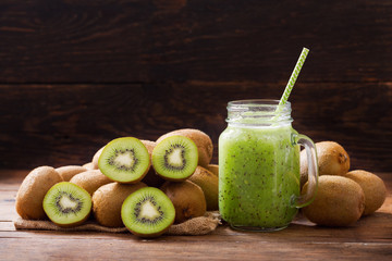 glass jar of kiwi juice or smoothie with fresh fruits