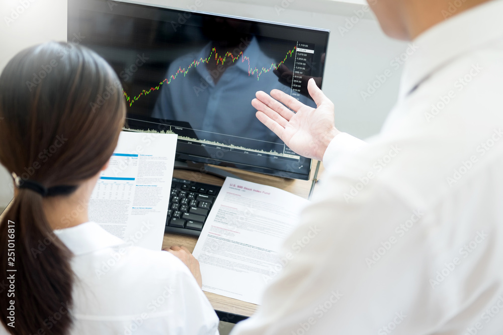 Poster team investment entrepreneur discussing and analysis forex trading charts and graphs on computer scr