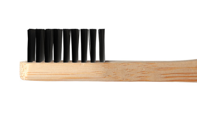 Toothbrush made of bamboo on white background, closeup