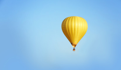 Fototapeta premium Beautiful view of hot air balloon in blue sky. Space for text