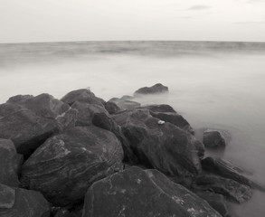 rocks in the sea at sunset
