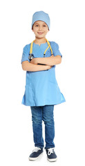 Cute little child in doctor uniform with stethoscope on white background