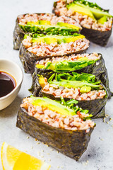 Vegetable onigirazu with brown rice, avocado and cucumber.