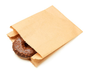 Paper bag with donut on white background. Space for design