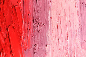Strokes of lipstick as background, top view