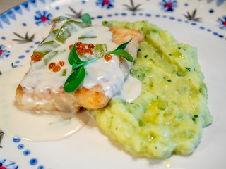 Grilled salmon fish with meshed potato